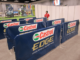 Custom printed steel barricade covers on display at an NFL event